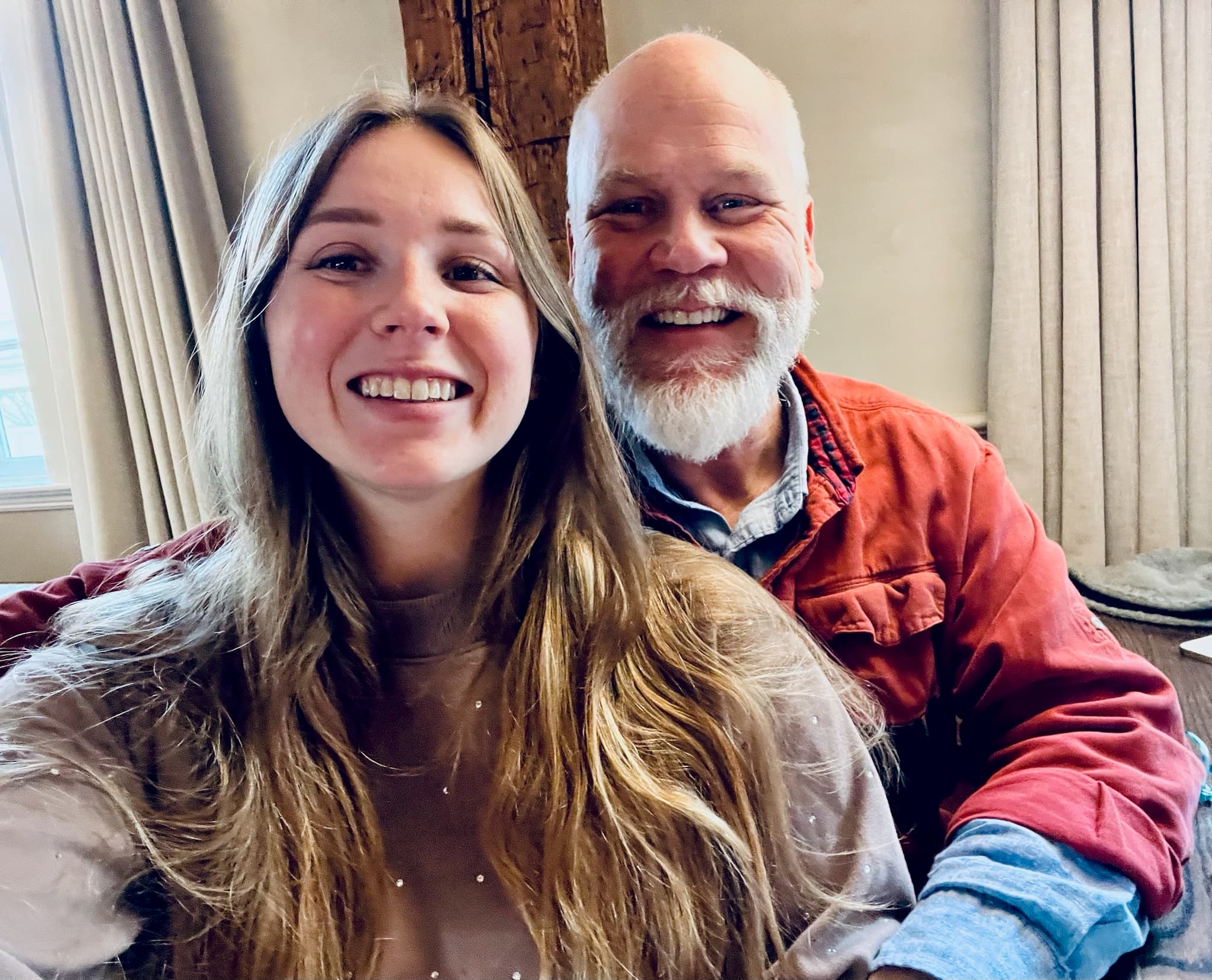 Selfie of woman and bearded man indoors