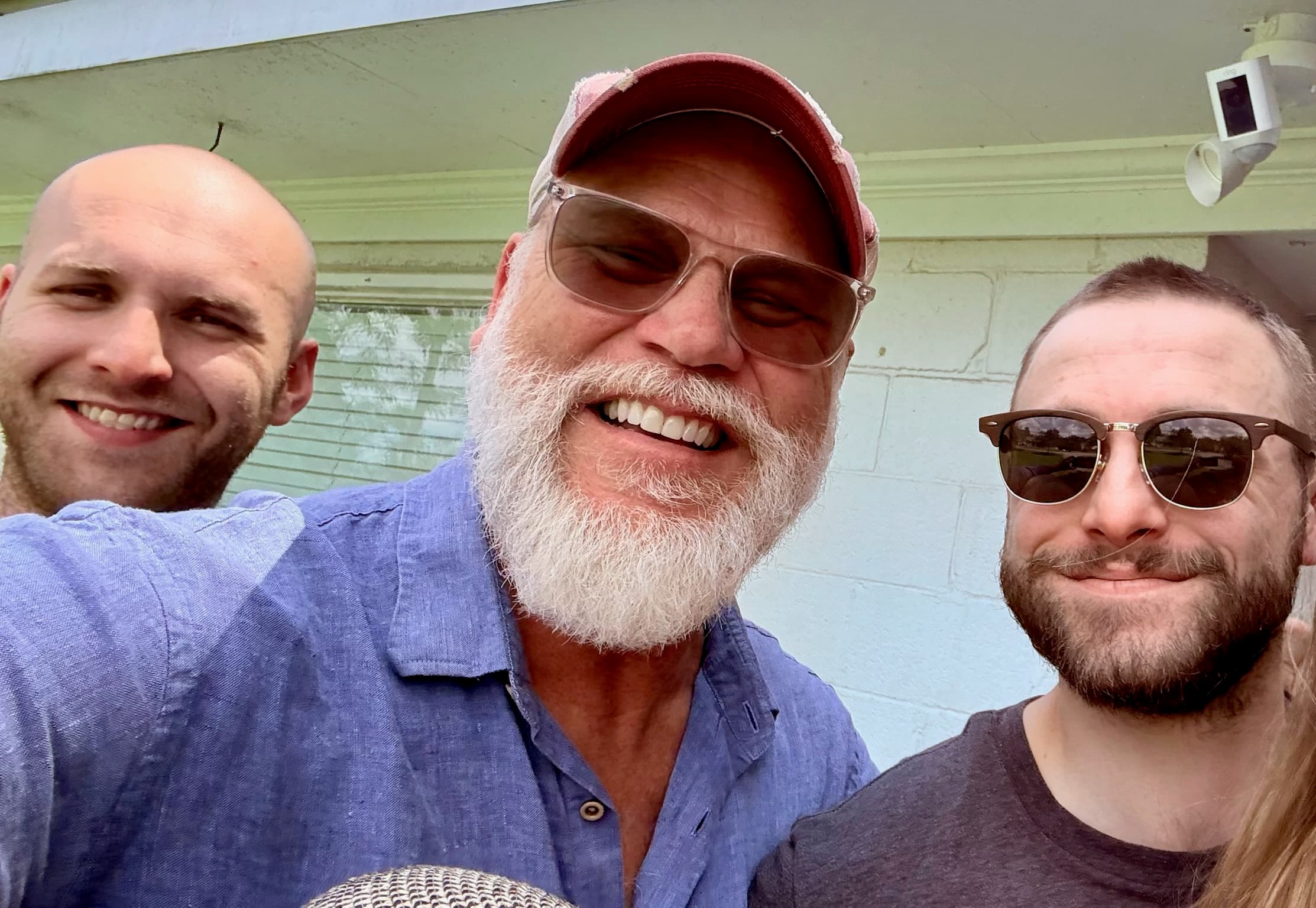 Three men on the porch