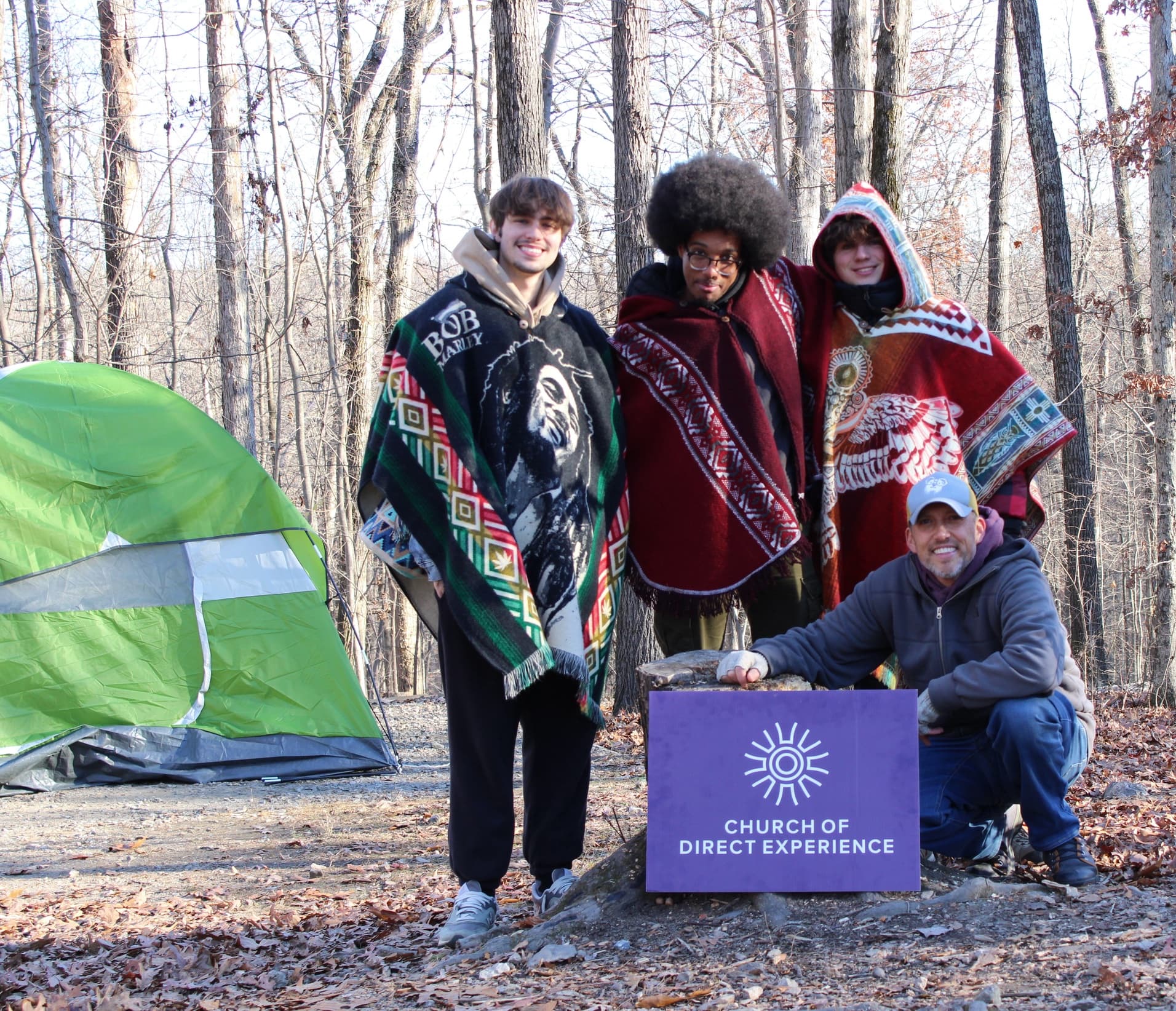 Kids camping with CODE sign