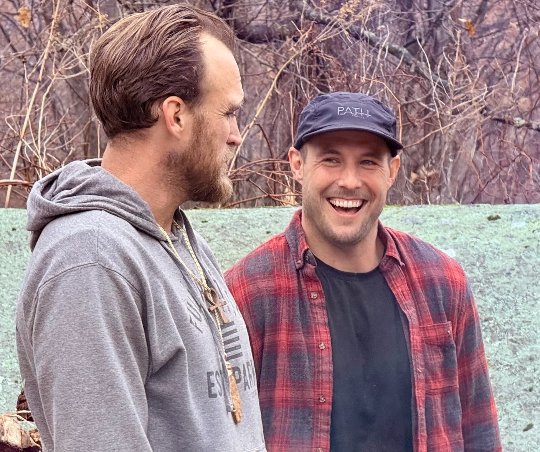 Two friends laughing outdoors