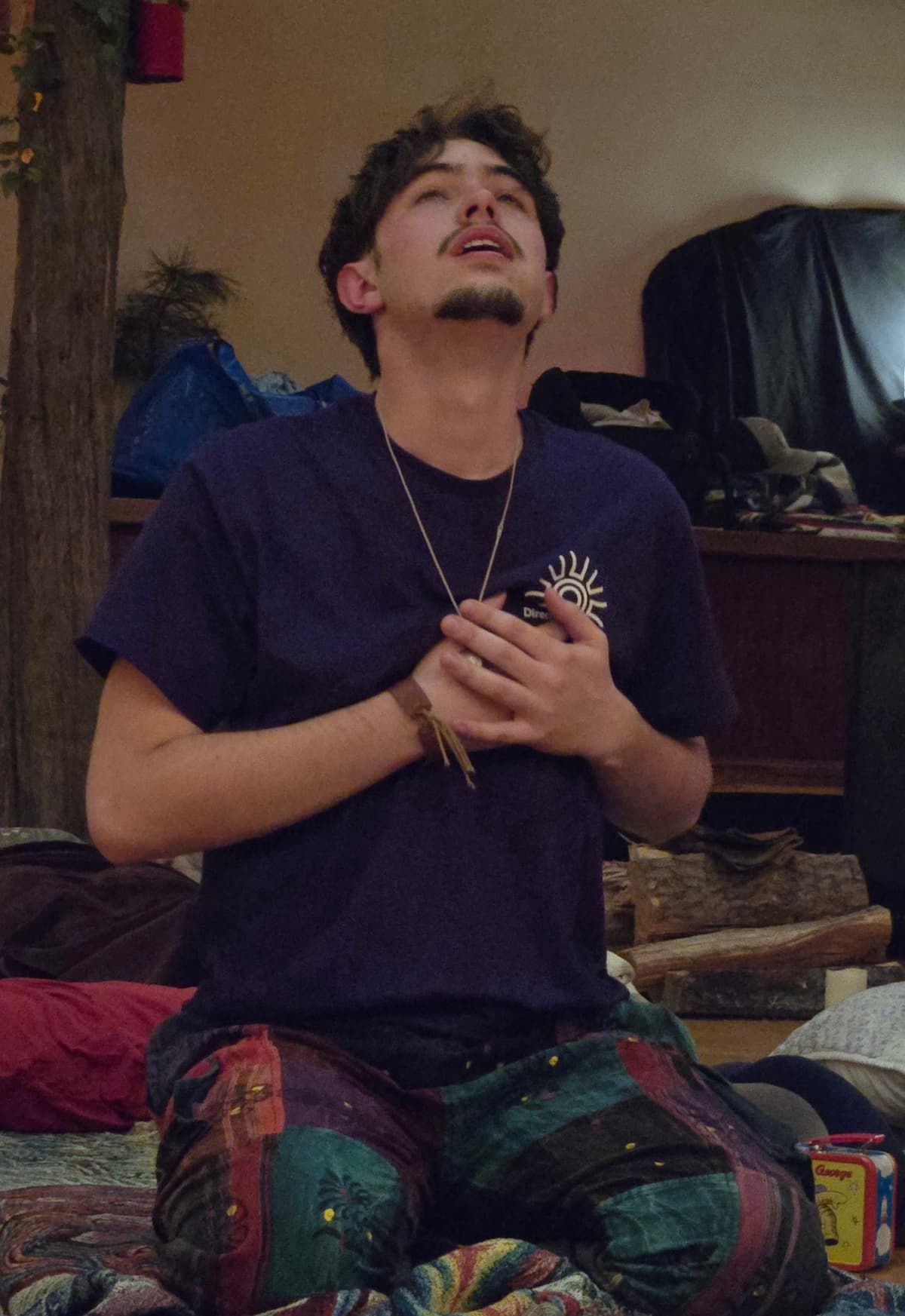 Young man in prayer during ceremony